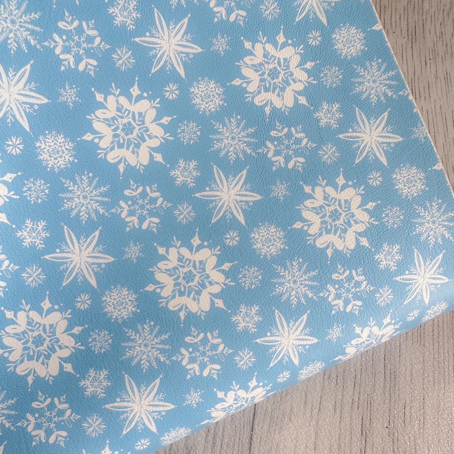 White Snowflakes on Blue Leatherette