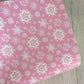 White Snowflakes on Pink Leatherette